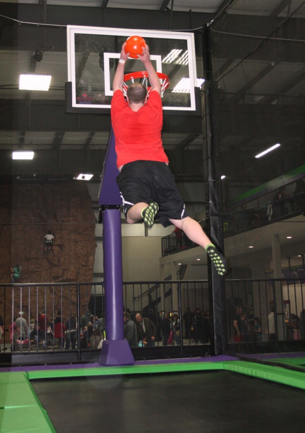 Boy Dunking on Trampoline BBall Court